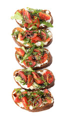 Delicious bruschettas with ricotta cheese, tomatoes and arugula isolated on white, top view