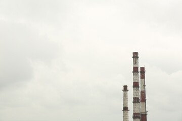 Modern power station against cloudy day, space for text