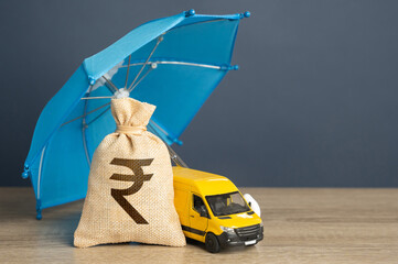 Delivery van and money bag with indian rupees under a blue insurance umbrella. Cargo and parcel...