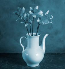 Vintage style flower in a vase on a blue background