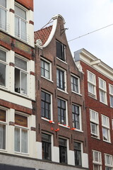 Amsterdam Haarlemmerdijk House Facade with Bell Gable and Orange Bunting, Netherlands