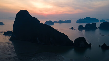 Beautiful and colorful sunrise over the sea. Large rocks in the sea. Dawn in Thailand. Colorful sky in the morning.	
