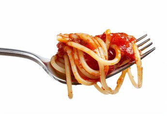 Close-up of Spaghetti with Tomato Sauce on Stainless Fork
