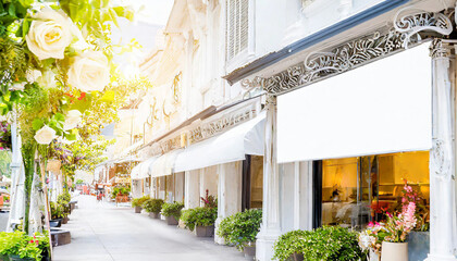 horizontal white empty signage on clothes shop front with glass windows