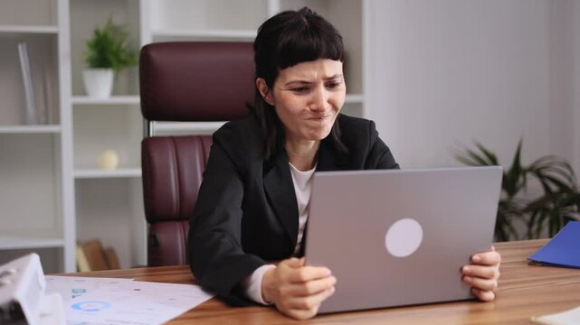 Sad young businesswoman feels annoyed having problems with laptop computer lost work at workplace System error data loss backup battery issues virus old equipment or technical malfunctions at office