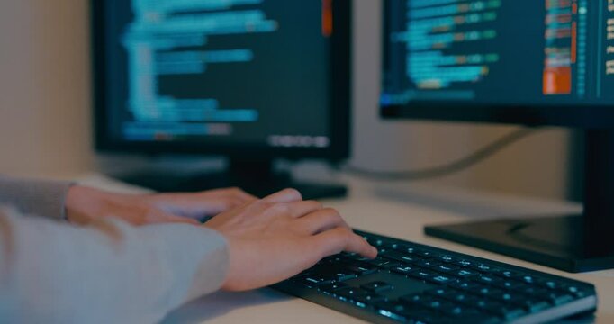 Closeup young adult Asia female freelance typing write prompt AI bot IT app program nomad, video game, terminal with coding language, designer, big data center on desktop computer in night office.