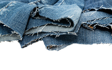 Piece of torn denim on a white background. Denim texture