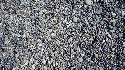 Sea pebbles background, grey stones, good texture 
