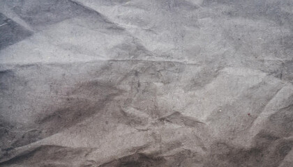 black crumpled paper texture blank dark background with creases