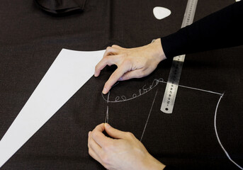 Tailor working in his tailor shop