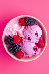 Top view of a bowl of huckleberry ice cream with berries