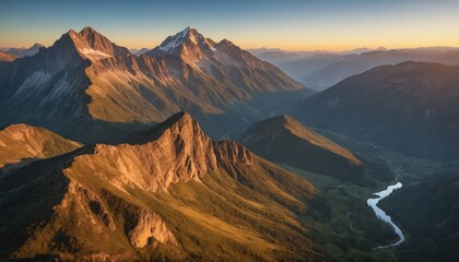 Naklejka premium Majestic mountain peaks bathed in the golden hues of sunrise