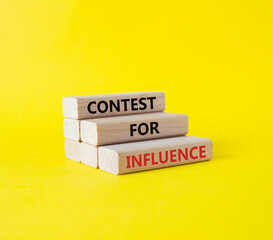 Contest for Influence symbol. Wooden blocks with words Contest for Influence. Beautiful yellow background. Business and Contest for Influence concept. Copy space.