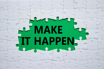 Make it Happen symbol. Concept words Make it Happen on white puzzle. Beautiful green background with succulent plant. Business and Make it Happen concept. Copy space.