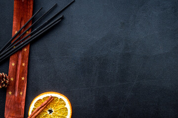 incense sticks with citrus for fresh air on dark background top view mock up