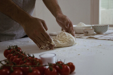 The dough for the perfect delicious pizza with home made tomato sauce and cheese