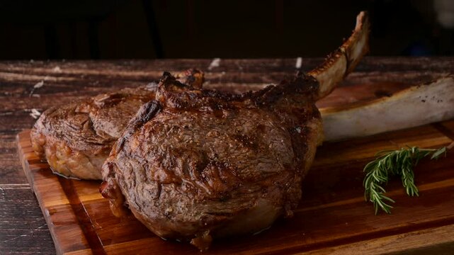grilled tomahawk steak on cutting board