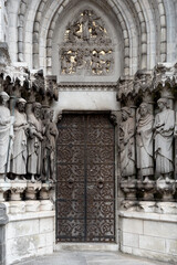 Line of statues of saints ant the entrance of St fin Barrers cathedral cork Republic Ireland