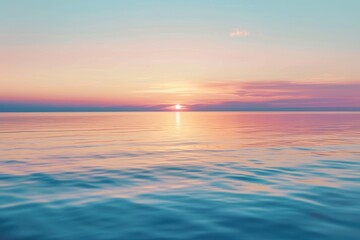 Fototapeta premium A serene photo of a sunset over a calm ocean