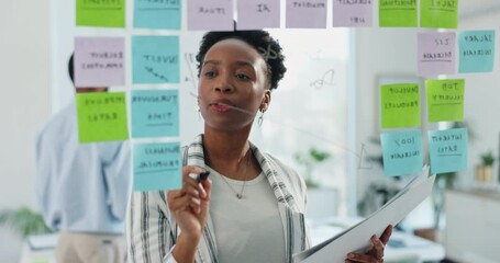 Woman, glass and sticky note in office for strategy, productivity schedule and creative agency for growth. Brainstorming, goals and employee for mind map, workplace and happy or smile for idea