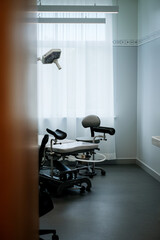Office of a doctor urologist in a medical clinic with a specialized bed