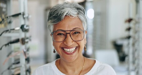 Optometry, glasses and face of senior woman in a clinic for vision, eye care or health with positive attitude. Happy, smile and portrait of female person from Mexico with spectacles in optical store.