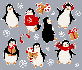 Sticker pack with penguins in different poses for the winter holiday. Christmas gifts, candy, sweater.