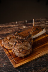 grilled tomahawk steak on cutting board