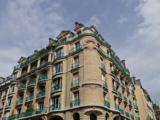 Fototapeta premium Paris, June 2024 : Visit of the magnificent city of Paris, Capital of France - View on different facades of buildings built by Baron Haussmann