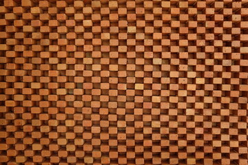 The pattern of brown bricks is arranged in alternating order. Create a textured background.
