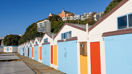 Iconic row of colourful boat sheds in Chaffers Marina of Oriental Parade waterfront in capital city...