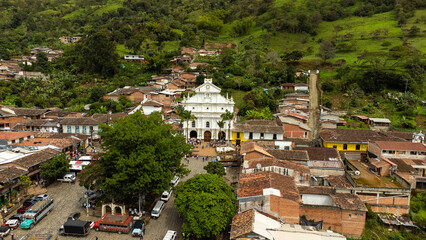 Fototapeta premium Angostura, Antioquia. Colombia - June 23, 2024. Aerial panorama made with a drone of the municipality of Angostura.