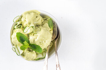 Healthy vegan cucumber ice cream, Alternative vegetarian raw frozen gelato dessert made from banana or avocado, cucumbers, lime and mint