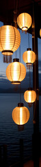 Warm-toned paper lanterns hang in a cluster.