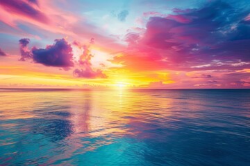 Fototapeta premium Mesmerizing sunset over a calm ocean with vibrant colors in the sky