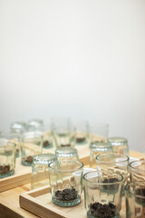 Glasses with Coffee Beans in Rows for Quality Tasting