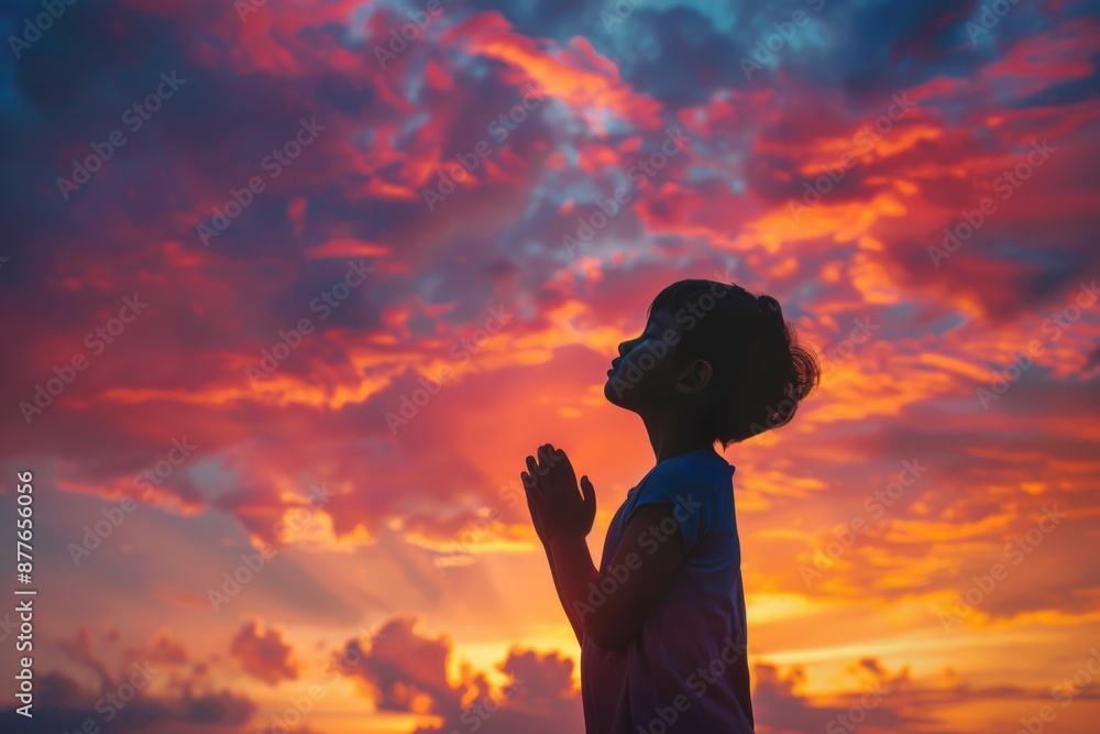 Poster a person standing in front of a beautiful sunset, great for use as a background or to represent a mo