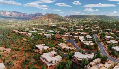 Neighbourhood houses in a desert suburb with mountain range in the background in the town of ...