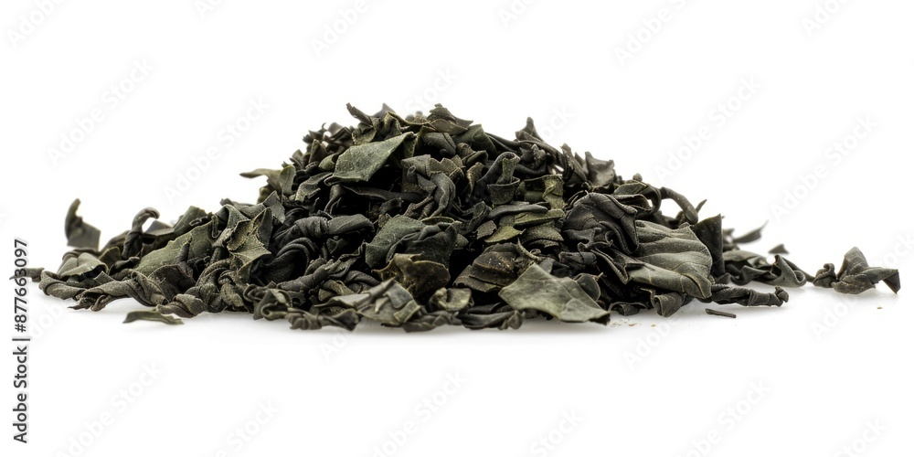 Poster a pile of dried leaves on a white surface, ideal for use in still life photography or as a prop in v
