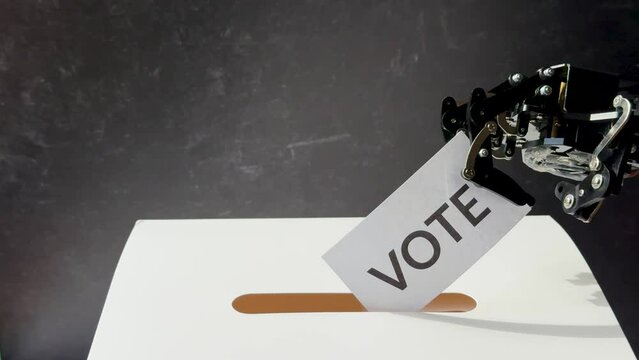 A hand displays "Fake News" and "Vote" cards, while a robotic arm interacts with a ballot in a voting slot.