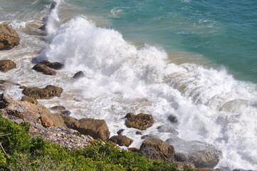Waves crashing onto rocky shore