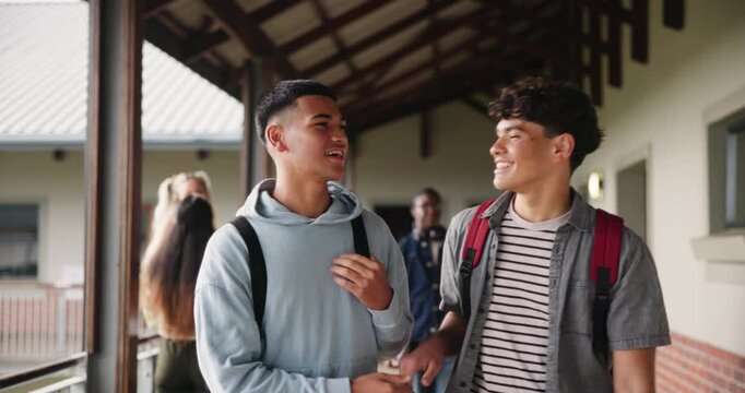 Friends, university and talking with handshake for education, greeting and learning for knowledge of study in hallway. Smile, men and students with fist bump for conversation, walking and classroom