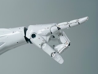 Robotic hand pointing with copy space, white artificial humanoid hand gesture on gray background