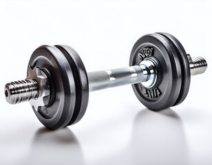 A sleek dumbbell rests on a reflective surface