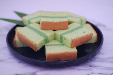 pandan cake on a black plate. Selective focus.