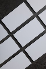 Obraz premium Blank business cards on grey textured background, top view. Mockup for design