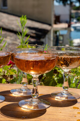 Summer party, French brut rose champagne sparkling wine in coupe glasses in yacht harbour of Port Grimaud near Saint-Tropez, French Riviera vacation, Var, France
