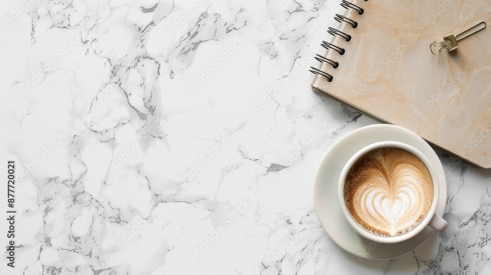 Poster notebook and coffee on marble surface with empty space