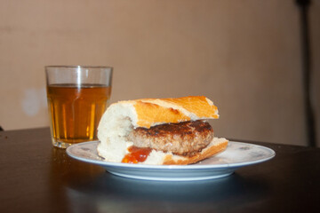 sandwich with burger ketchup and soft drink