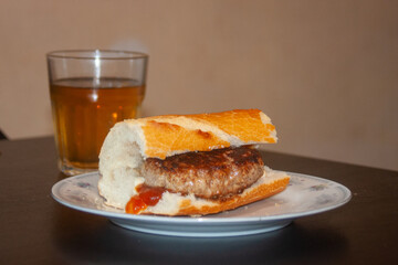 sandwich with burger ketchup and soft drink